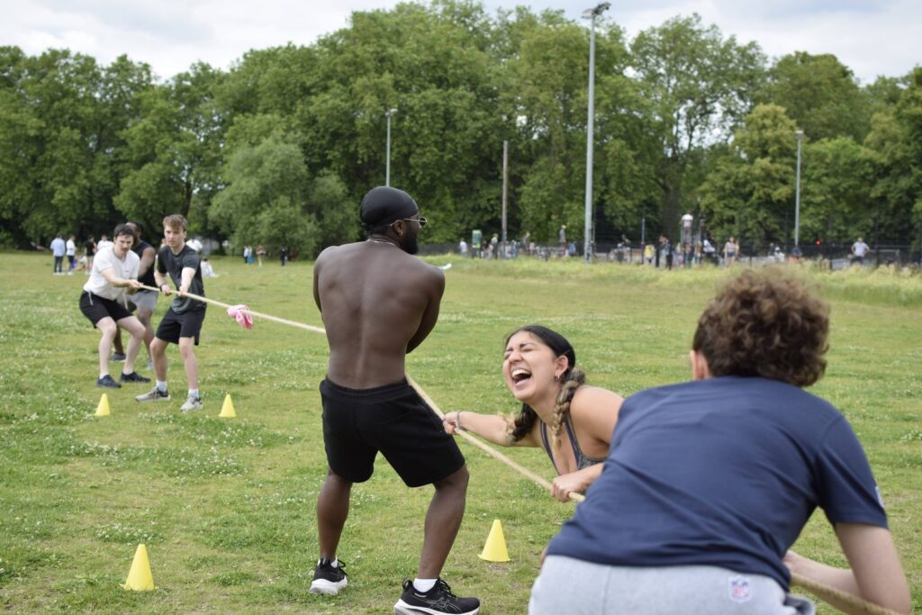 SWBW members pulling together in a tug of war during a bootcamp session