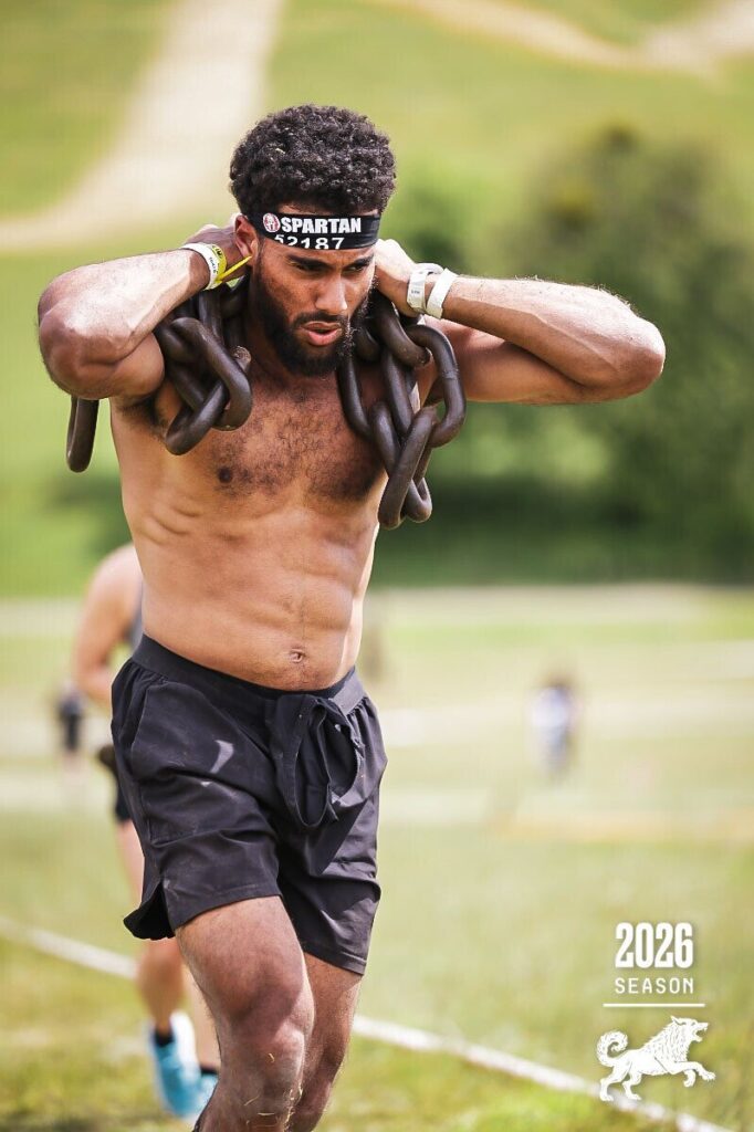 SWBW member carrying heavy chains during a hypertrophy training session