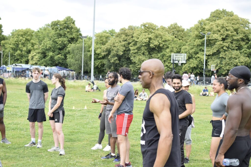 A mixed SWBW group gathered in a South London park before a session